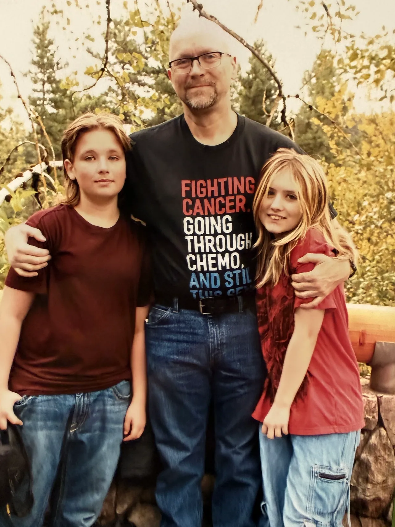 Man with two children outdoors