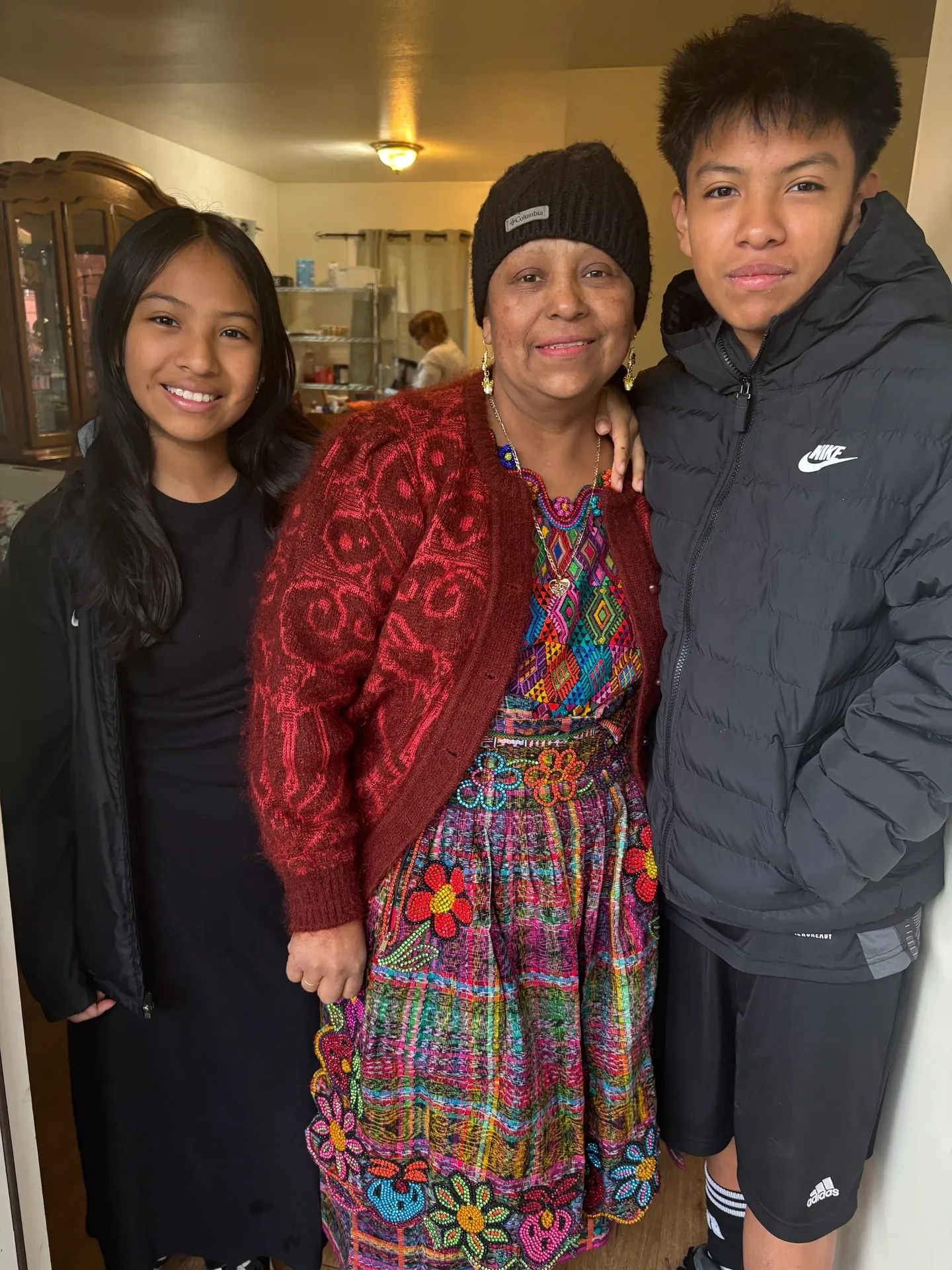 Mother with children in a kitchen