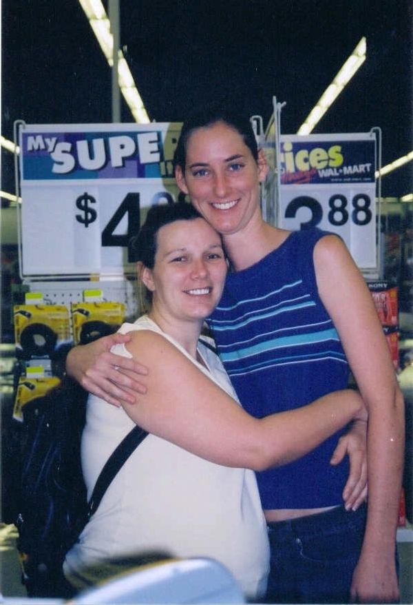 Two women hugging in a store