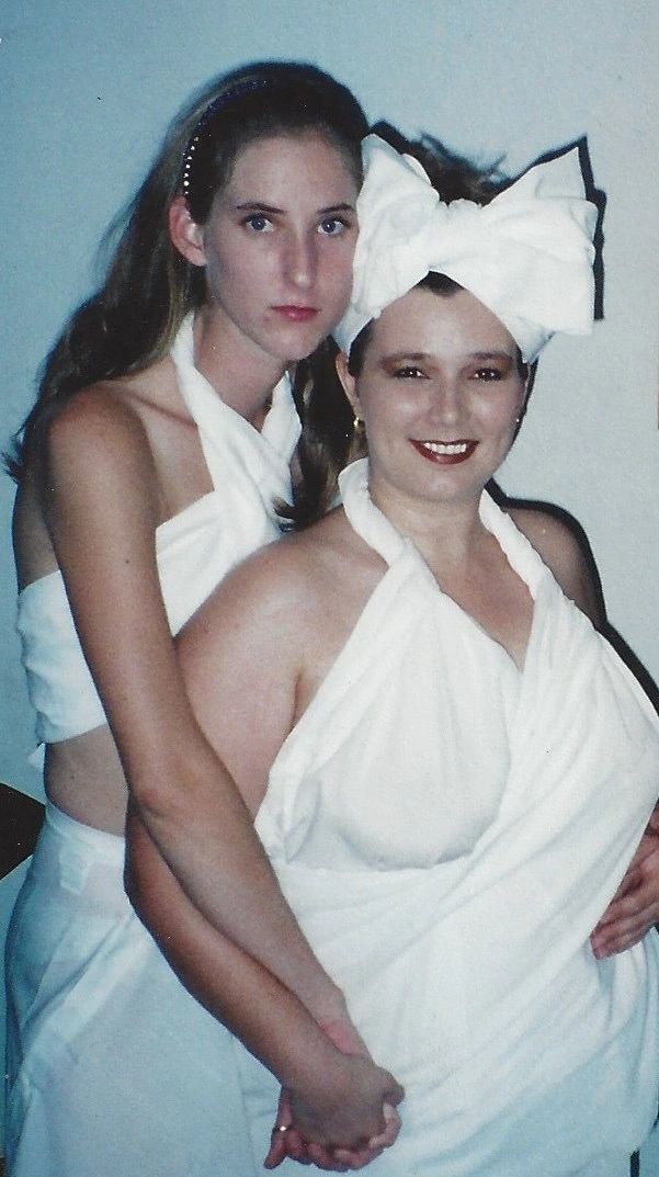 Two people in white draped outfits