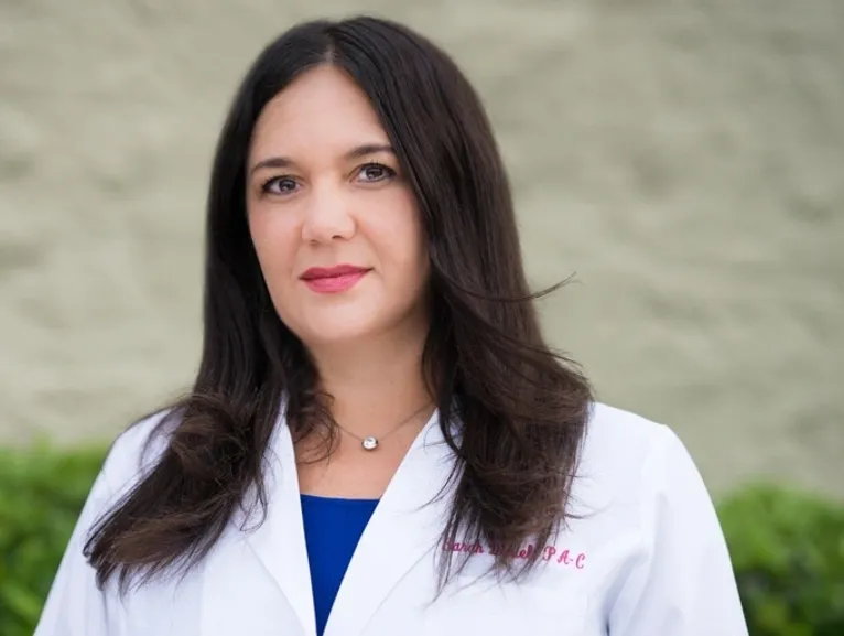 Female medical professional posing confidently