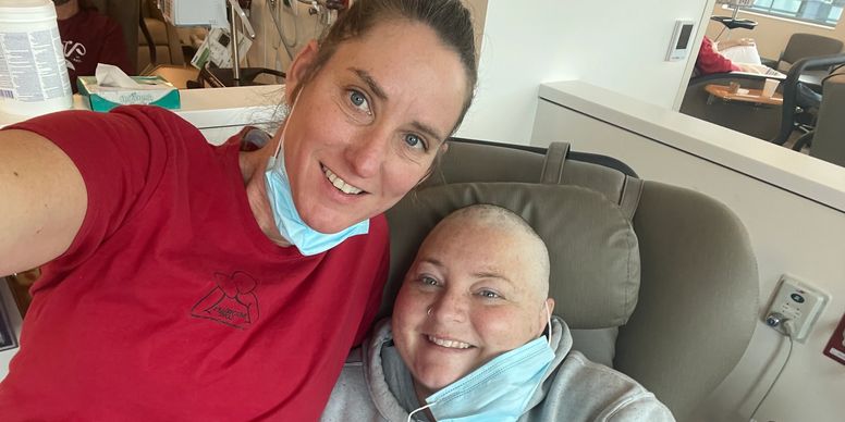 Two people smiling during hospital visit