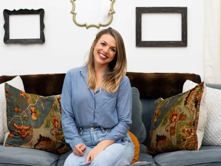 Happy woman with decorative pillows